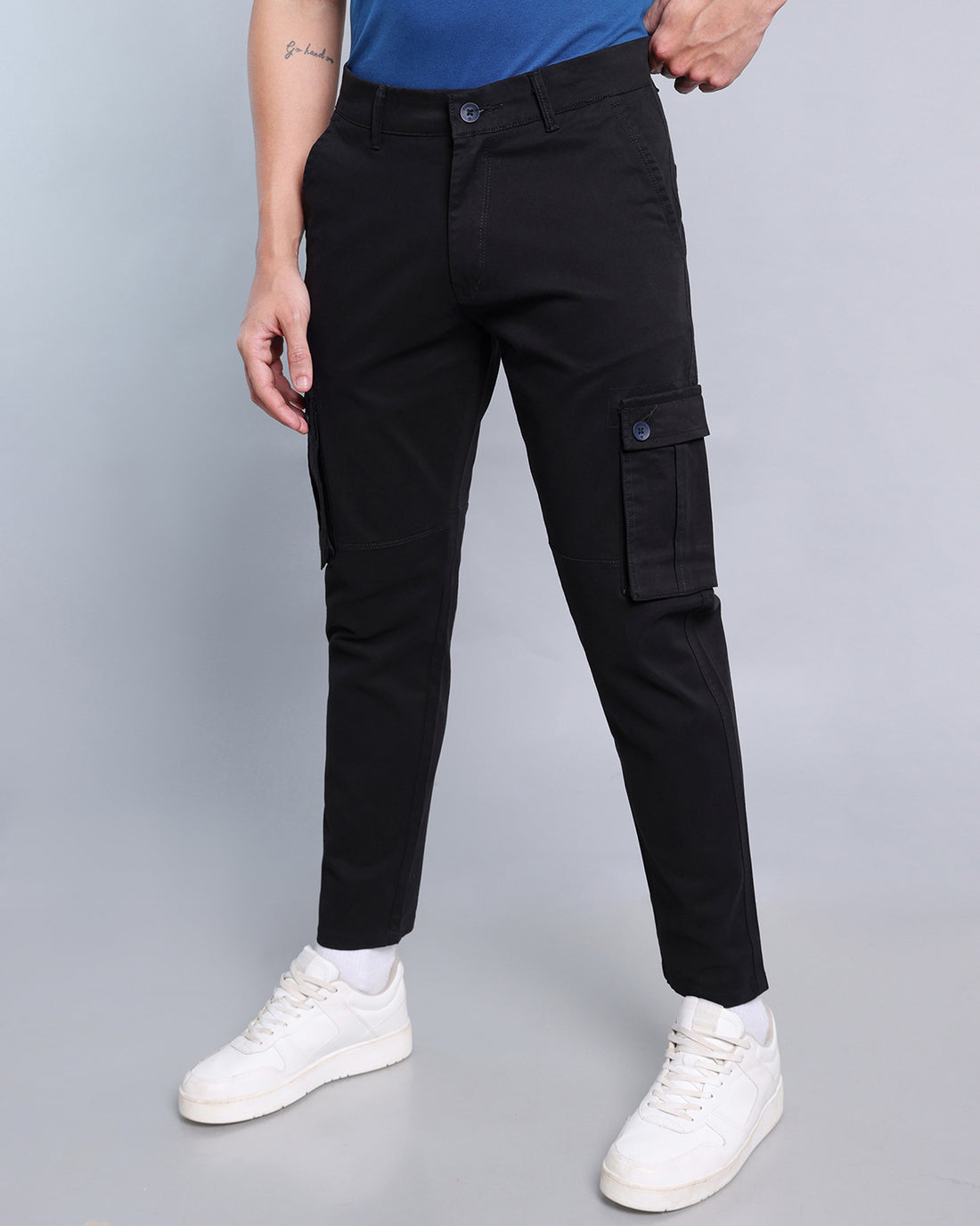 Slim black stretch-cotton cargo pants with narrow legs and shallow thigh pockets